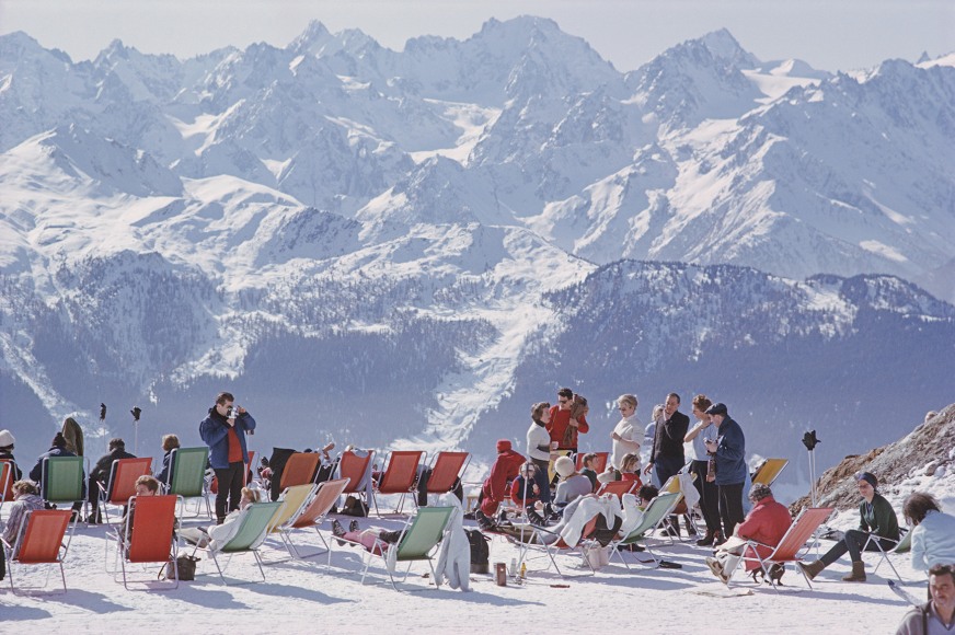 Slim Aarons, Lounging In Verbier: Holidaymakers in sun loungers on the slopes at Verbier, Switzerland, February 1964