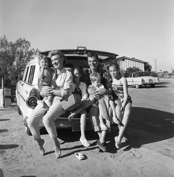 Sid Avery, Eve Arden on Tailgate of Station Wagon, 1956