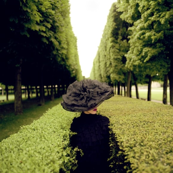 Rodney Smith, Woman with Hat Between Hedges, Parc de Sceaux, France, 2004