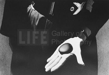 John Loengard, Georgia O’Keeffe holds her favorite stone in her rock collection, Abiquiu, New Mexico, 1966