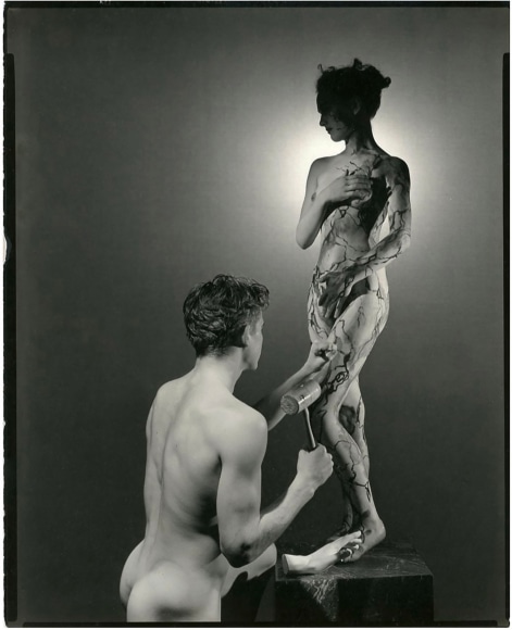 George Platt Lynes, Pygmaleon &amp; Galatea, c. 1937. Male nude figure kneeling before a standing female nude. The male is posed with tools as if sculpting the female from marble.