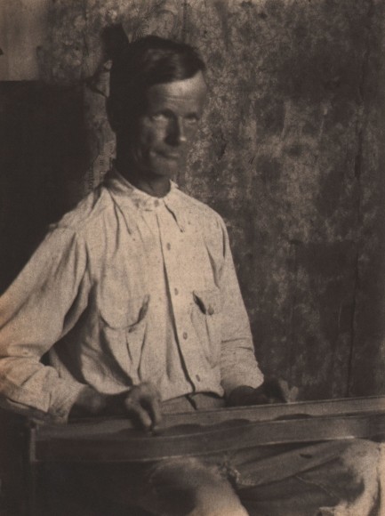 Doris Ulmann, The Song in the Wood (Man playing dulcimer), ​1928&ndash;1934. Soft-focus seated man with both hands on the instrument in his lap.