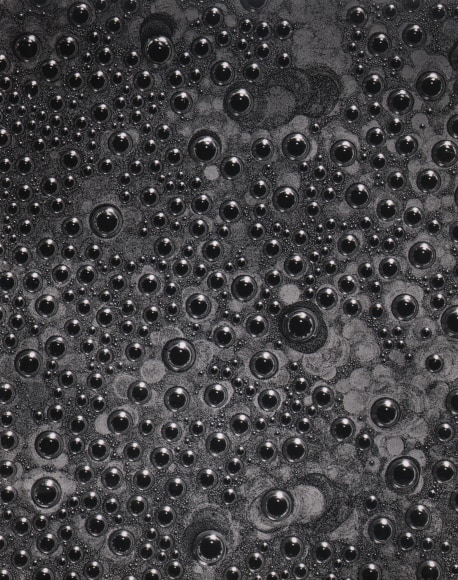 Don Worth, Untitled, ​c. 1955&ndash;1960. Abstract, dark photo of bubbles on a liquid's surface.