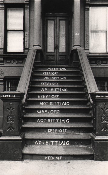 15. Beuford Smith, NO and KEEP OFF, Harlem, ​1982. A building stoop with &quot;No sitting&quot; and &quot;Keep off&quot; written on alternating steps.