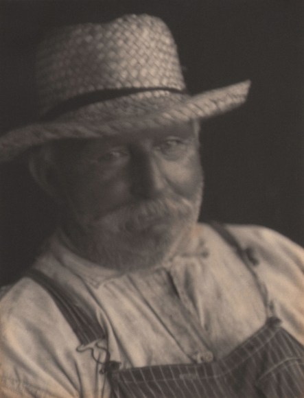 Doris Ulmann, Untitled (Farmer), 1928&ndash;1934. Head-and-shoulders portrait of man in straw hat and striped overalls looking to camera.