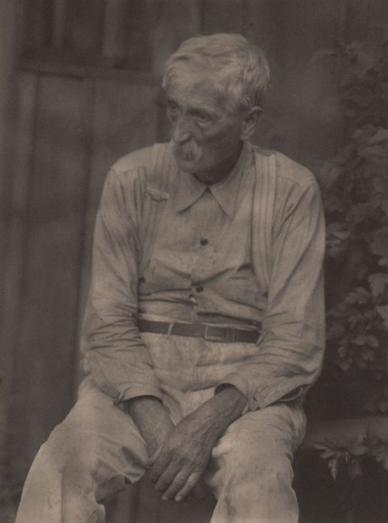 Doris Ulmann, Mr. Solomon Halcolm, most important folk singer living, ​July 1932. Man seated outdoors in light clothing and suspenders with hands in his lap.