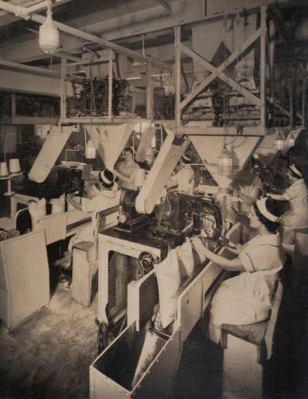 Harold Haliday Costain, Long Island City Plant, ​1935. Rows of women operate machinery.