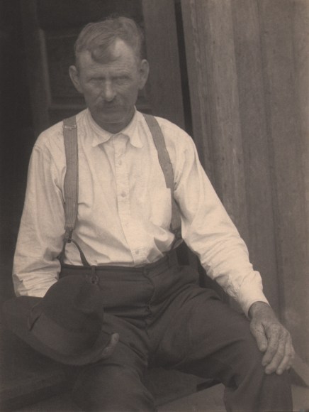 Doris Ulmann, Untitled (Gentleman farmer), ​1928&ndash;1934. Seated man in white shirt and suspenders holds hat in his lap and looks to the camera.