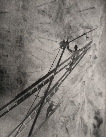 Harold Haliday Costain, Stygian Flight, Avery Island, Louisiana, Illustration for International Salt, ​1935. Two men on high ladders in the mine.