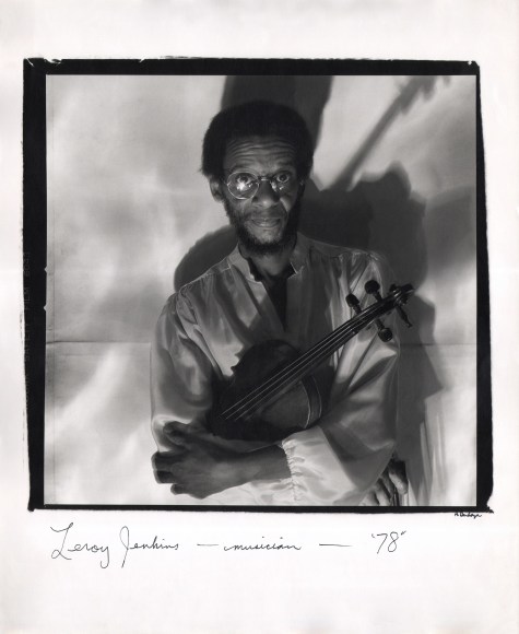 Anthony Barboza, Leroy Jenkins - Musician, ​1978. Subject's upper body in right-center of square frame. He holds a violin in crossed arms.