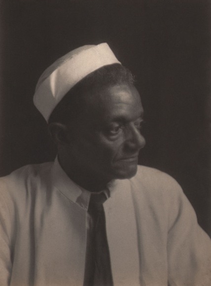 Doris Ulmann, Untitled (Cook), ​1928&ndash;1934. Man in white shirt, black tie, and white hat looking to the right of the frame.