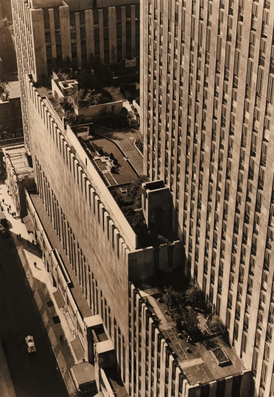Paul J. Woolf, Hanging Gardens at Rockefeller Center, ​c. 1935. Elevated courtyard photographed from above, street runs up the lower left of the frame.