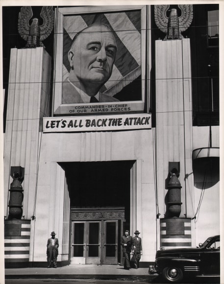 22. Gordon Coster, Let's All Back the Attack, c. 1943. Mural above a building entrance with a portrait that reads &quot;Commander-in-Chief of Our Armed Forces - Let's All Back the Attack&quot;