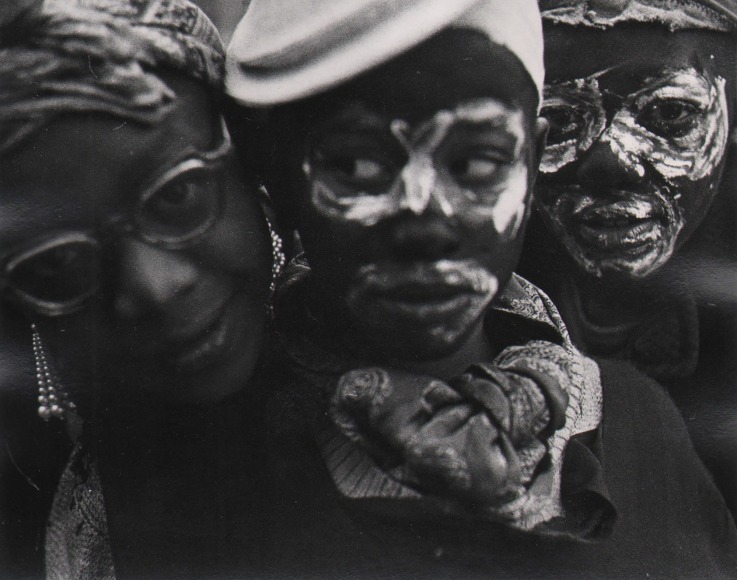 Marvin E. Newman, Chicago, ​1950. Close-up portrait of a woman in glasses and two young boys wearing white face paint.