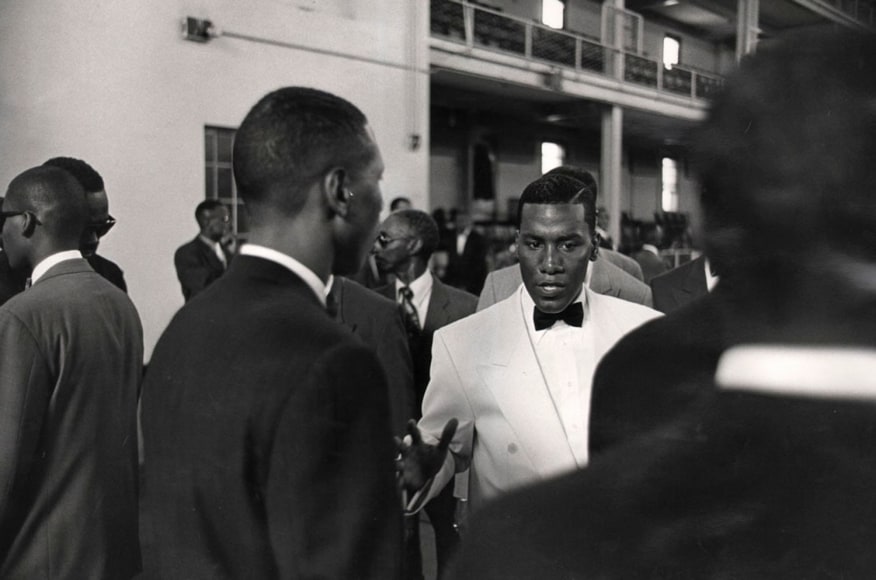 08. Minister Conrad Muhammad in White: Minister Conrad Muhammad of Temple #7 Nation of Islam speaks to officers in his security corps before an event at the Harlem Armory, 1993.