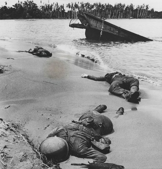 10. George Strock (1911-1977), Three dead Americans on the beach at Buna (Sept. 20, 1943 Issue, p. 35), 1943