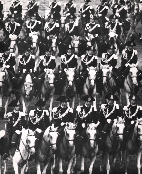 Gianni Berengo-Gardin, Untitled, c. 1958. Four rows of uniformed military officers on horseback fill the frame.