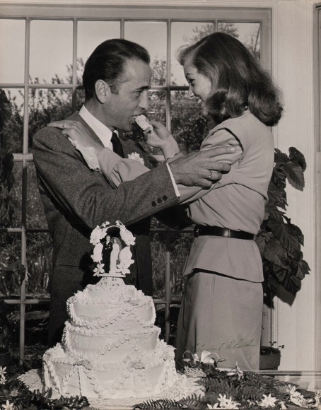 55. Ed Clark (1911-2000), Lauren Bacall fed wedding cake to her groom, Humphrey Bogart, after their marriage ceremony in Ohio&nbsp;(June 4, 1945 Issue, p. 29), 1945