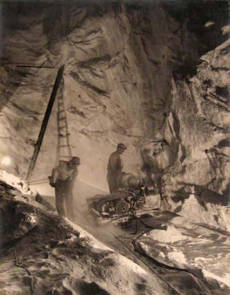 Harold Haliday Costain, The Undercutters at Work, Avery Island, Louisiana, ​1934. Two men operate machinery in a mine.