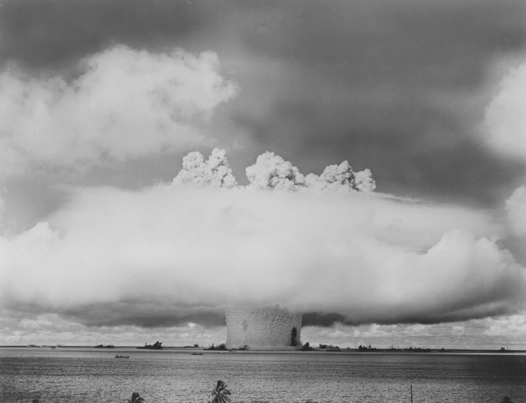 12.&nbsp;U.S. Department of Defense, Rising column of water enters the first phase of characteristic mushroom. At the base of the column of water is cruiser SALT LAKE CITY; in foreground is Japanese battleship NAGATO, Bikini Atoll in the Pacific Ocean&nbsp;(Variant, Aug. 12, 1946 Issue, p. 30), 1946