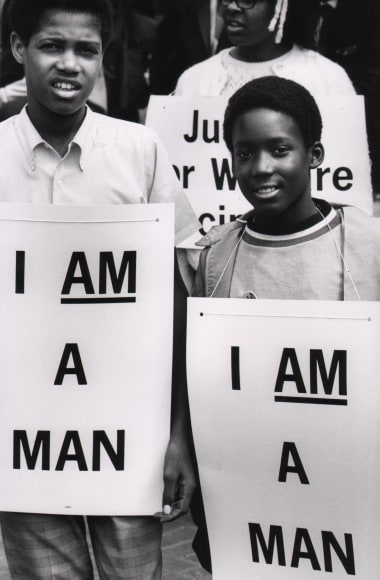 35. Flip Schulke, I Am a Man/Union Justice Now, Martin Luther King Memorial March for Union Justice and to End Racism, Memphis, Tennessee, ​1968. Two young men look to the camera with signs on their chests that read &quot;I am a man&quot;