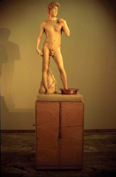 Cody Choi. Cody's Legend Freud's Shit Box, 1994-95. Wax, Pepto-bismal, banding straps, yellow tin, aluminium, wood and steel, 97 x 97 x 264 cm. Courtesy of the artist & PKM Gallery.