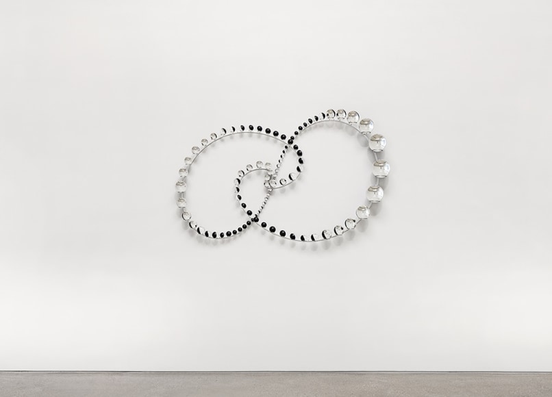 Olafur Eliasson, 𝘖𝘳𝘣𝘪𝘵𝘢𝘭 𝘤𝘦𝘯𝘵𝘳𝘪𝘧𝘶𝘨𝘢𝘭 𝘱𝘳𝘦𝘴𝘦𝘯𝘤𝘦, 2022. Partially silvered glass spheres, stainless steel,, paint (black, white), 113 x 174 x 20 cm. 