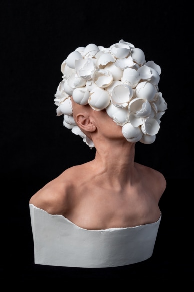 J.J. McCracken  The Feeding  2020, painted platinum silicone lifecast, eggshells, ceramic, 22 x 16 x 12 inches.