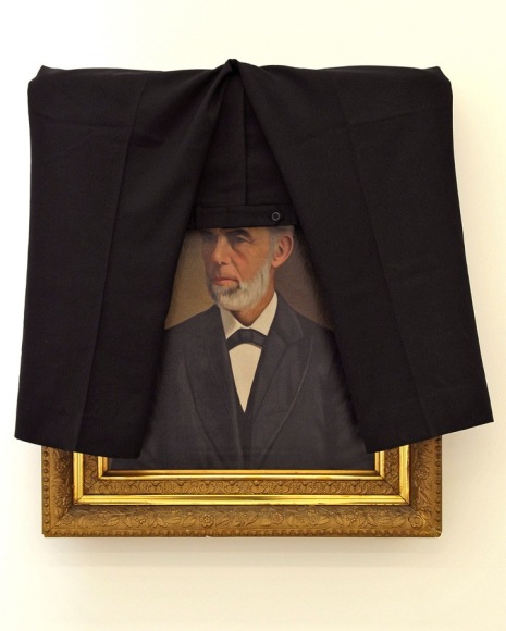 JOHN KIRCHNER Virginia Gentleman With Pants on His Head 2007, framed oil on canvas and wool pants, 33 x 33 inches.