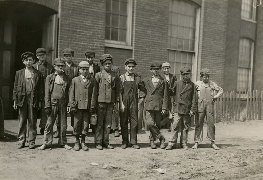 ­Lewis Hine Group of workers at Sagamore Mills #1. Some of these were boys we saw on Friday P.M., four on two floor, three on next floor, dodging about behind spinning frames as though trying to avoid being seen. Location: Fall River, Massachusetts,1911
