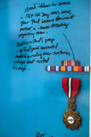 Michael Rakowitz,&nbsp;Paul (Palestine)&nbsp;(detail), 2012, Vintage satin, medals, lacquer pen writing