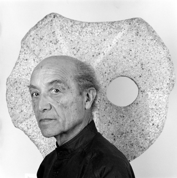 Portrait of the Noguchi with sculpture.