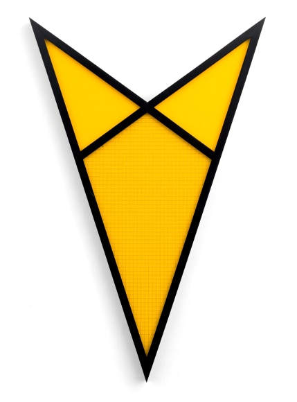 Sculpture of a yellow arrow with black edges.