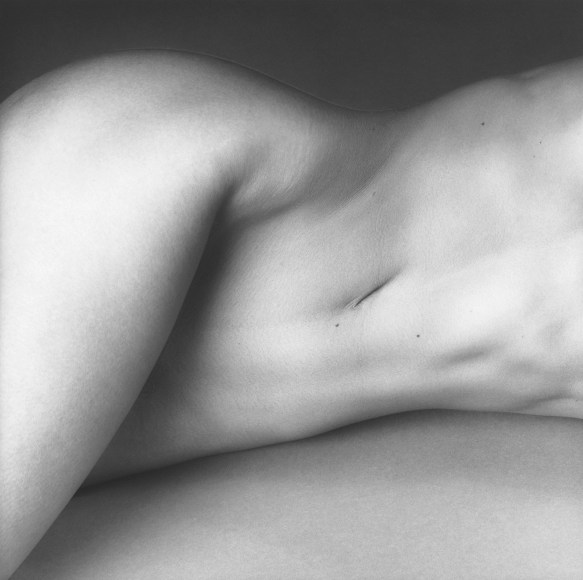 Nude woman's torso.