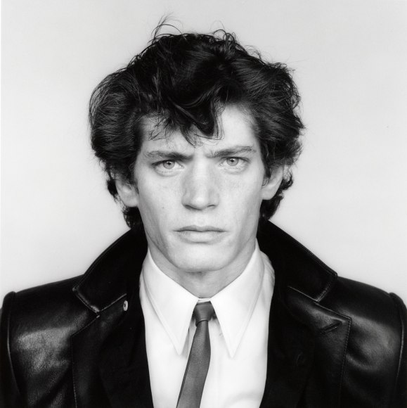 Self-Portrait of the artist in suit and tie.