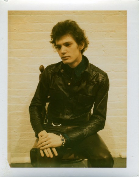 Self-Portrait in chair in color.