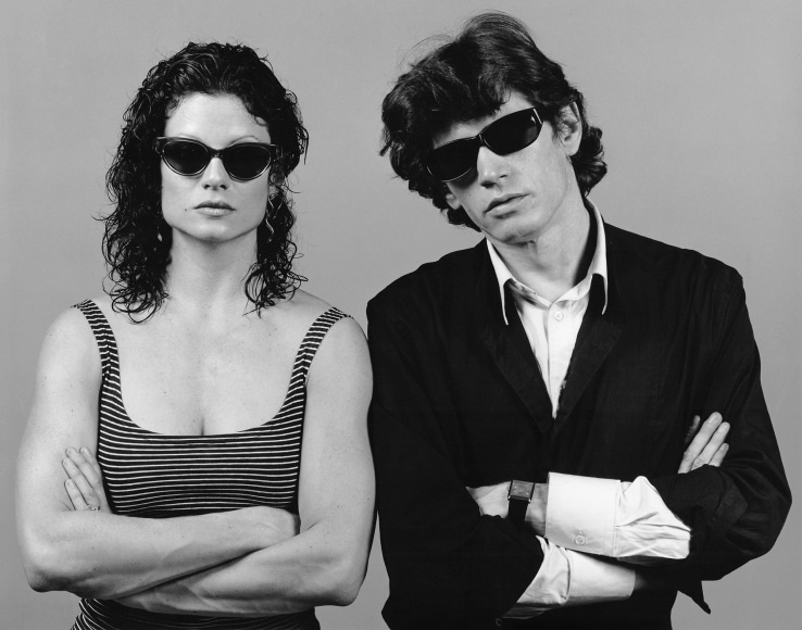 Portrait of Lisa Lyon and the artist in sunglasses.