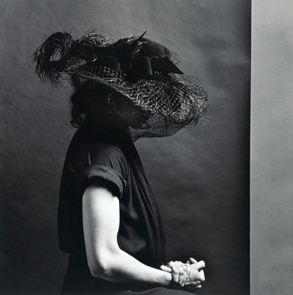 Lisa Lyon wearing a large hat.