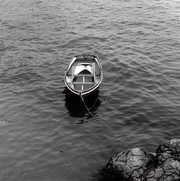 Row boat in the water.