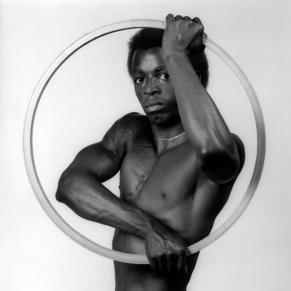 Dennis holding a ring.