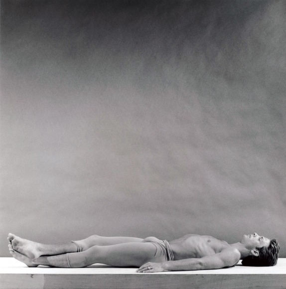 Peter Reed lying on floor wearing dance tights.