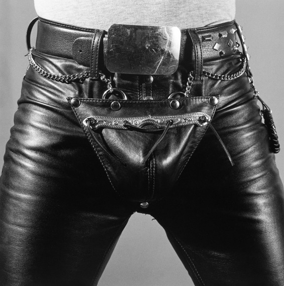Man wearing leather pants and a belt.