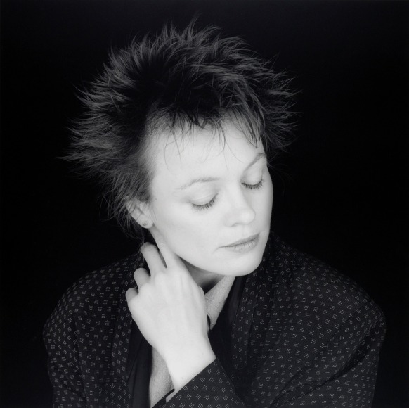 Portrait of Laurie Anderson looking down.