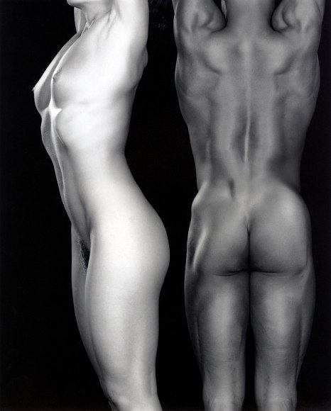 Ken and Lydia--both nude--with arms up.