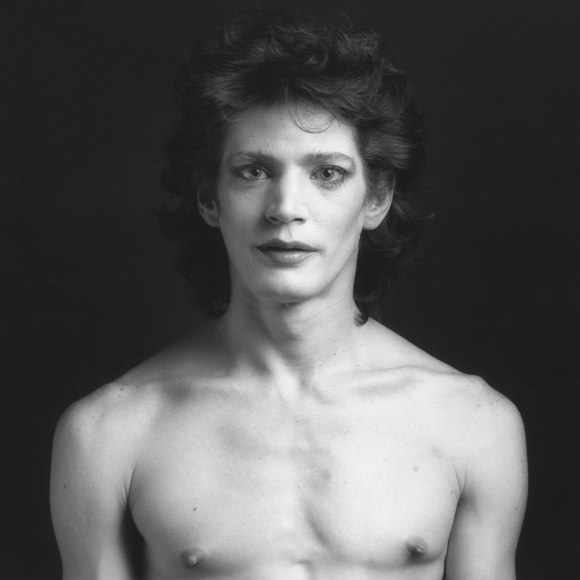 Shirtless Self-Portrait wearing makeup, facing straight to camera.