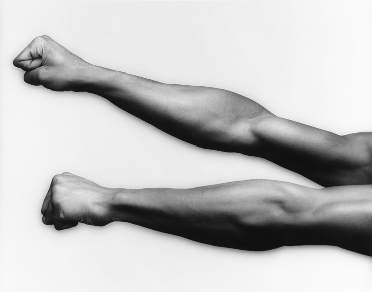 Ken Moody's arms and fisted hands outstretched.