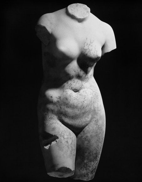 Sculpture of a woman without head, arms, and legs.