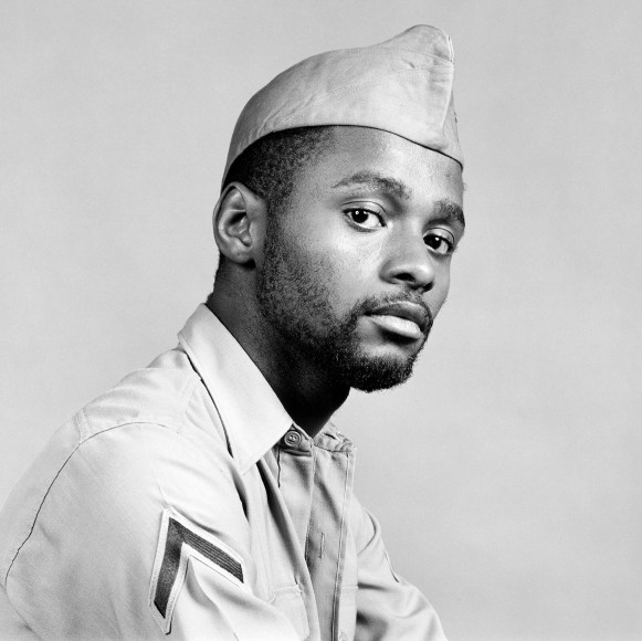 Close up of a man in three-quarter view wearing a uniform.