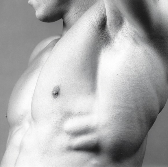 Male nude's chest and armpit.