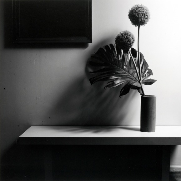 Bouquet of flowers in vase on table.